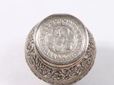 an image of a silver box on a white surface