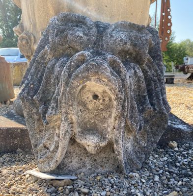 a large stone object that is sitting on the ground