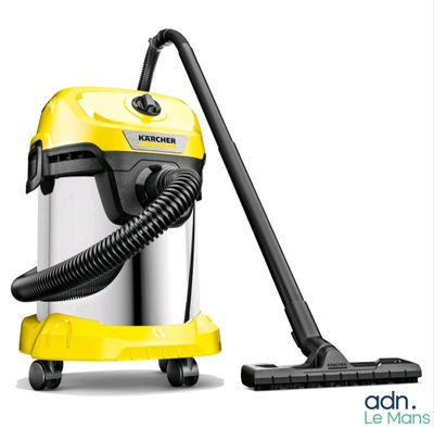 a yellow vacuum cleaner with a black hose on top of it