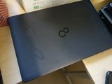 a laptop that is sitting on a table with a box
