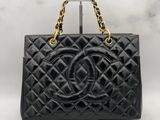a chanel black quilted leather handbag with gold hardware