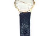 a close up of a watch on a white background