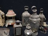 many different types of antique lanterns on a black background