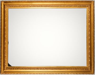 a gold framed mirror on a wall with a white background