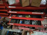 many different types of screws and nuts in this garage