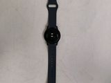the back side of a black apple watch with a black strap