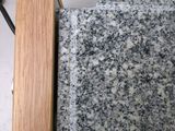a close up of a piece of wood on a counter top