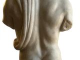 marble statue of a man with his back turned to the side