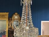 a chandelier that is hanging from the ceiling in a room