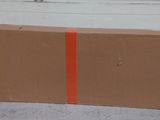 a cardboard box that is sitting on the ground