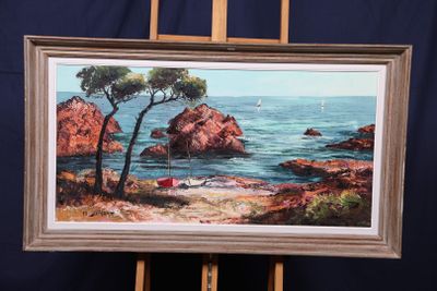 une photo d'un tableau posé sur un chevalet au bord de l'eau