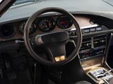 a car dashboard with a steering wheel and dashboard gauges