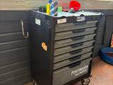 an image of a black tool cabinet in a garage