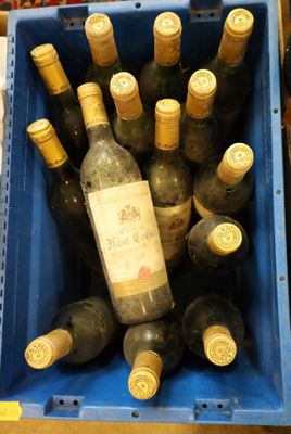 many bottles of wine in a blue crate on the table