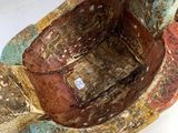 a ceramic turtle that is sitting on a white surface