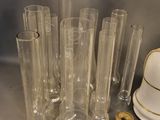 a lot of glass vases that are sitting on a table