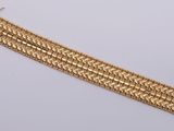an image of a gold bracelet on a white background