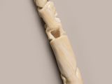 a close up of a piece of wood with carvings on it