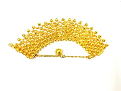 an image of a gold beaded bracelet with a gold ball clasp