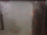 a close up of a metal container with writing on it