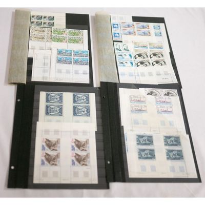 several different types of stamps are displayed in a folder on a table