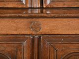 a close up of a wooden cabinet with a clock on top of it