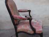 a chair that is sitting in front of a wall