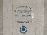 a plaque on the wall of a building with a blue seal on it