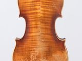 an old violin with a wooden back and a long neck