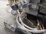 a machine that is sitting on the ground in the garage