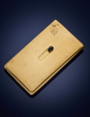 a gold plated nokia phone on a blue background