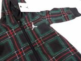 a black and green jacket with a red and green plaid pattern on it