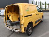 a yellow van that is parked in a parking lot