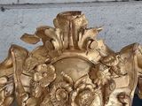 a gold frame with a picture of a lion on it