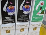 three boxes of tea are stacked on top of each other in a store