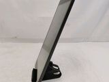 a close up of a tablet computer on a stand on a white surface