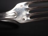a fork that has a small hole in the middle of it