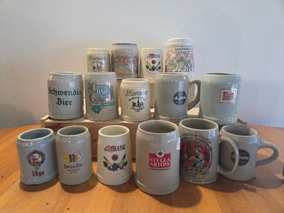 a lot of coffee mugs sitting on a table