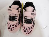 a pair of pink and black shoes with black laces on them
