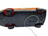 a toy car with wheels attached to it on a white surface