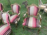 many chairs that are sitting in the grass