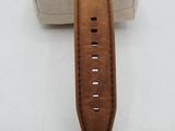wrist watch with brown leather band and black face