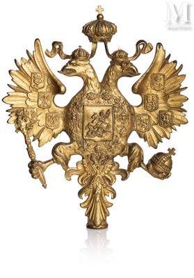 an image of a gold eagle with a crown on top of it