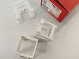 three pieces of plastic that are sitting on a table