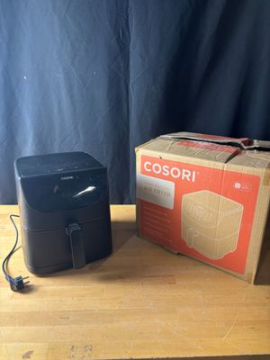 an image of a box and a black printer on a wooden table