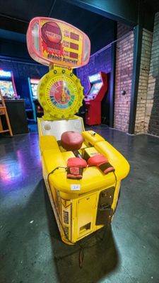 a game machine that is sitting in the middle of a room