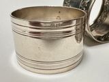 a silver cup that is sitting on a table