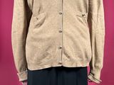 an image of a woman ' s jacket and skirt on a mannequin