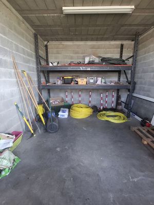 a garage with a lot of tools and supplies in it