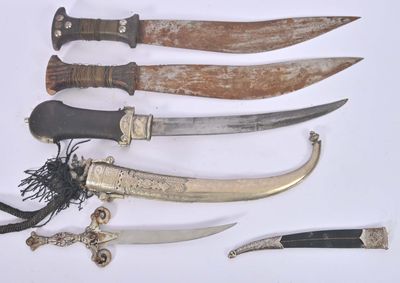 five different types of knives on a white surface